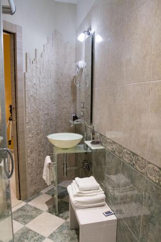 a bathroom with a sink and a shower at La Suite del Faro in Scalea