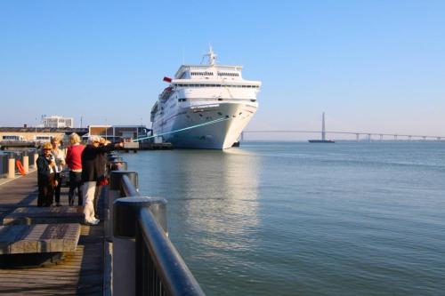 a cruise ship is docked at a dock at Shangri-La in Folly Beach