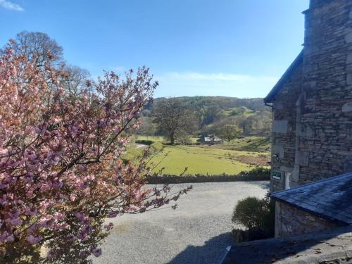 a view of a field from a house at Crow How Country Guest House in Ambleside