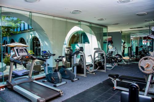 a gym with a bunch of treadmills and machines at Radisson Lagos Ikeja in Lagos