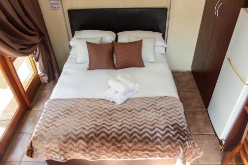 Postel nebo postele na pokoji v ubytování Echo Garden Guesthouse