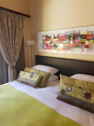 Postel nebo postele na pokoji v ubytování Echo Garden Guesthouse