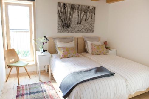 Un pat sau paturi într-o cameră la Dom Pod Lipami