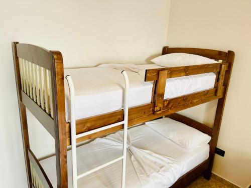 a couple of bunk beds in a room at Atlantis Apartments in Orikum
