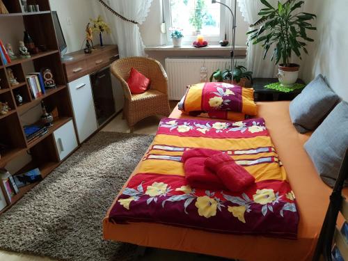 a bedroom with a bed and a table with pillows at Ferienwohnung Lotti in Lutherstadt Wittenberg