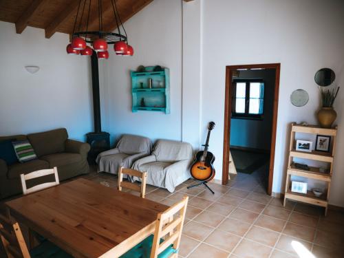a living room with a couch and a table at Soul Farm Algarve - Glamping & Farm Houses in Aljezur