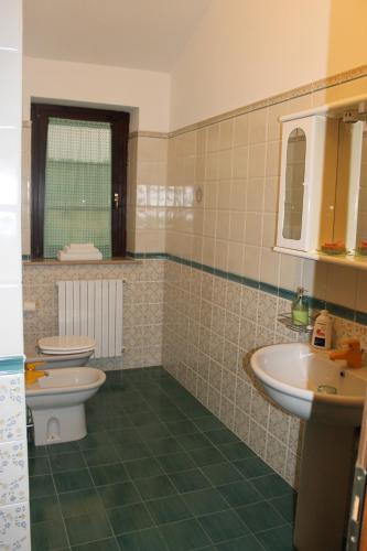 a bathroom with two toilets and a sink at Sinilù B&B in Silvi Paese