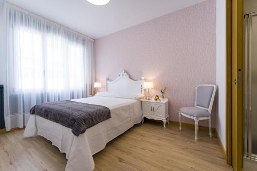 Postel nebo postele na pokoji v ubytování Pensión Ferradura