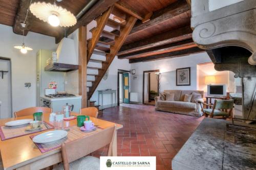 a large living room with a table and a couch at Castello di Sarna in Chiusi della Verna