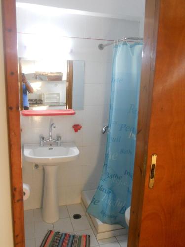 a bathroom with a sink and a shower at Assimakis Hotel in Finikounta