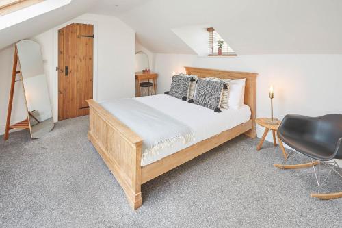 a bedroom with a bed and a desk and a chair at Burnsyde Beach House - With Sea Views in Saltburn-by-the-Sea