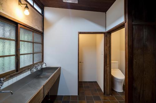 a bathroom with a toilet and a sink at 平野邸 Hayama in Hayama