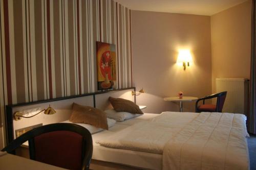 Ένα ή περισσότερα κρεβάτια σε δωμάτιο στο Hotel Seewiefken