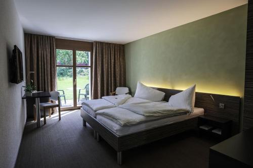 Postel nebo postele na pokoji v ubytování Hotel Restaurant Seegarten