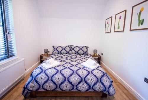 Cama o camas de una habitación en Southgate Coach House