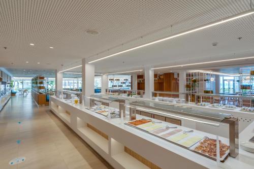 a store with a lot of food on display at Playa Esperanza Resort Affiliated by Meliá in Playa de Muro