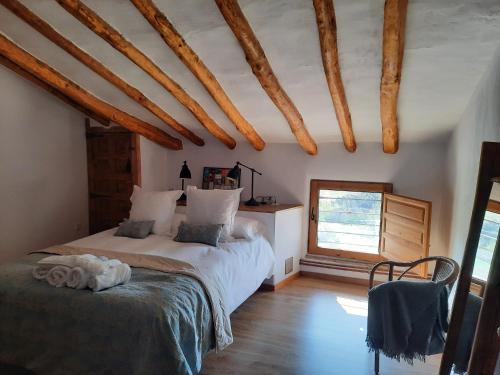 En eller flere senger på et rom på La Sargantana Turismo Rural