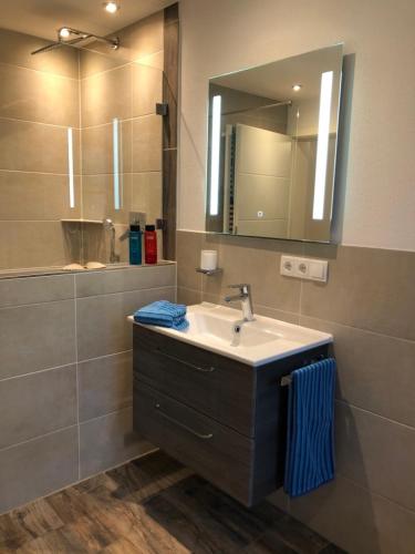 a bathroom with a sink and a mirror at Haus Christ in Anger
