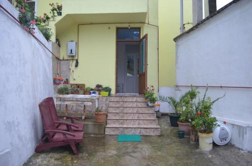 a stairway leading to a house with a door at Akhmed Guest House in Kvariati
