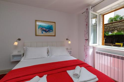 Postel nebo postele na pokoji v ubytování Apartments Lavizatic