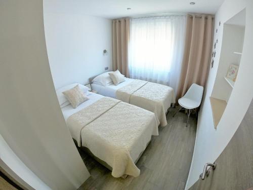 Postel nebo postele na pokoji v ubytování Apartment STELA - Private terrace & Parking