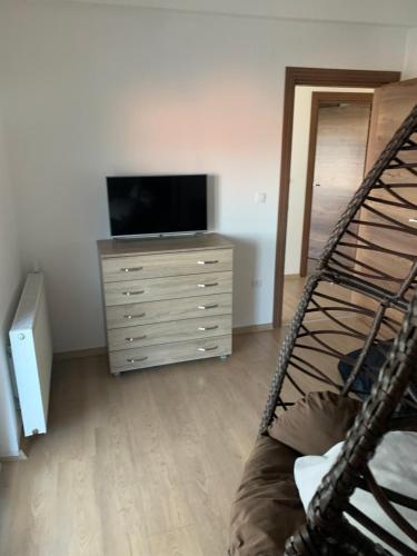 a bedroom with a bunk bed and a television at LUXURY VILLA M NEAR 2km AWAY FROM BITOLA WITH PRIVATE SWIMMING POOL & SAUNA &JACUZZI in Bitola