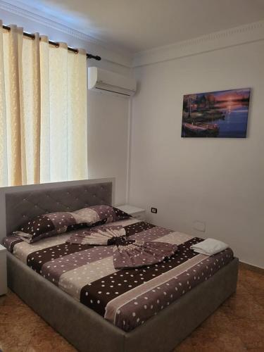a large bed in a bedroom with at Hotel Reci in Peshkopi