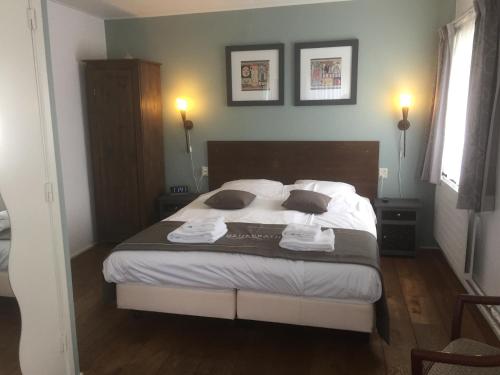 Ένα ή περισσότερα κρεβάτια σε δωμάτιο στο Hotel Heijenrath