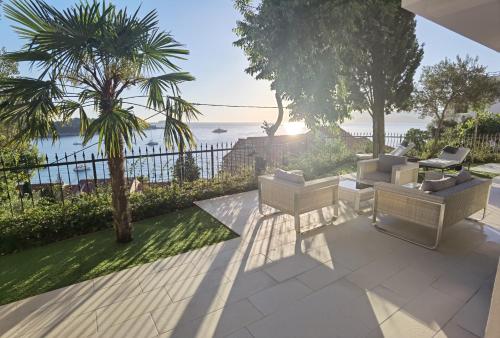 a patio with a view of the ocean at Villa Gloria in Cavtat