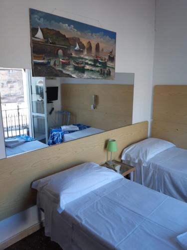 Postel nebo postele na pokoji v ubytování Hotel Guesthouse MASSENA