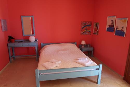 Ліжко або ліжка в номері Akrogiali Beach Apartments