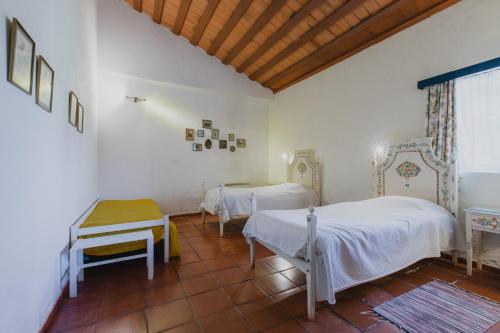 En eller flere senger på et rom på Monte Da Serralheira Agro Turismo