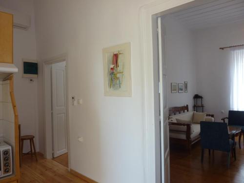 an open door to a room with a living room at A Painter's House in Plaka in Athens