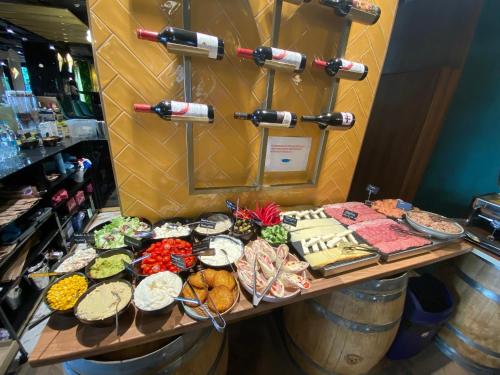 a table filled with lots of different types of food at Mercure Timisoara in Timişoara