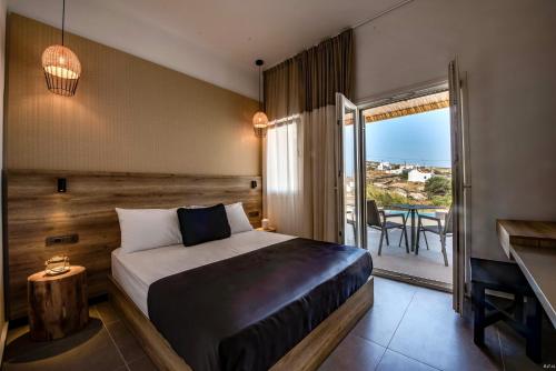 Postel nebo postele na pokoji v ubytování CASA DI PIETRA MYKONOS