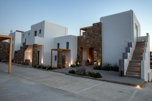 a rendering of a villa at dusk at CASA DI PIETRA MYKONOS in Klouvas