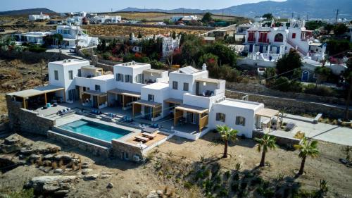 an aerial view of a villa with a swimming pool at CASA DI PIETRA MYKONOS in Klouvas