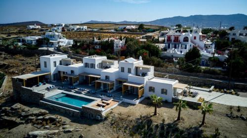 an aerial view of a house with a swimming pool at CASA DI PIETRA MYKONOS in Klouvas