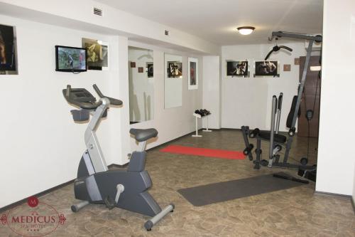 a gym with two exercise bikes in a room at SPA Hotel Medicus in Varshets