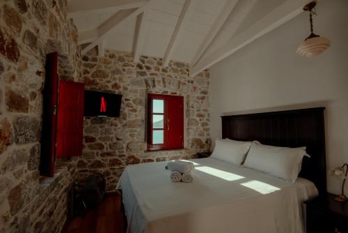 Ένα ή περισσότερα κρεβάτια σε δωμάτιο στο Limeni Villa