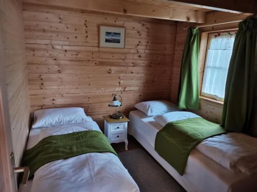 A bed or beds in a room at Novák porta vendégház-Tab, Zala