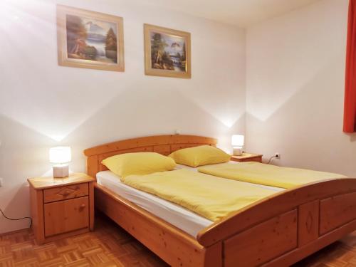 a bedroom with a bed and a lamp at Rooms & Apartments Pr Matjon in Bled