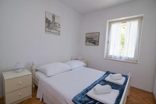 Postel nebo postele na pokoji v ubytování Villa Garina 1