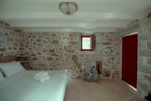 Ένα ή περισσότερα κρεβάτια σε δωμάτιο στο Limeni Villa