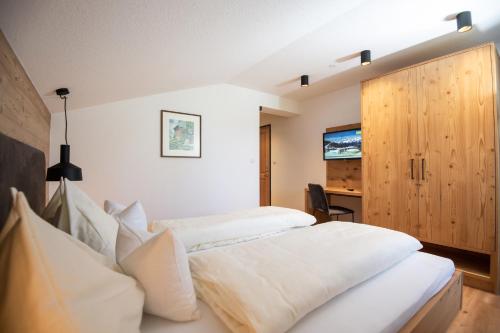 מיטה או מיטות בחדר ב-Urlpoldhof