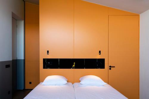 Postel nebo postele na pokoji v ubytování De 6 Linden Boutique Hotel