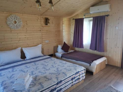 Postel nebo postele na pokoji v ubytování La 3 Casute