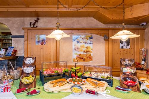 a table with many different types of food on it at Zum kleinen Italiener - Ristorante Pizzeria Pension in Geinberg
