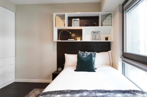 a bedroom with a large bed and a window at Chapter Old Street in London in London