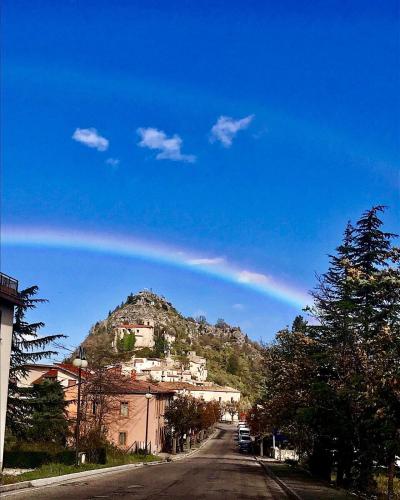 a house on top of a hill on a street at B&B La Torre in Rosello
